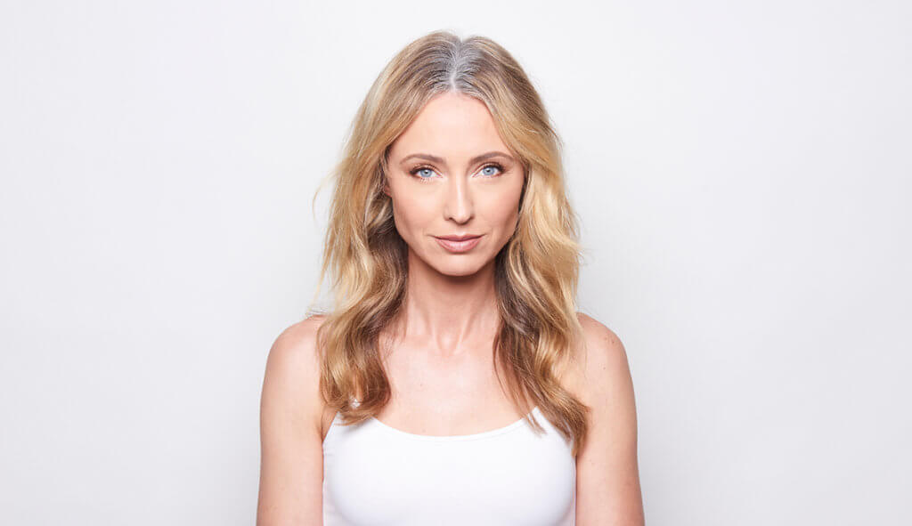 Women showing grey roots before hair coloring