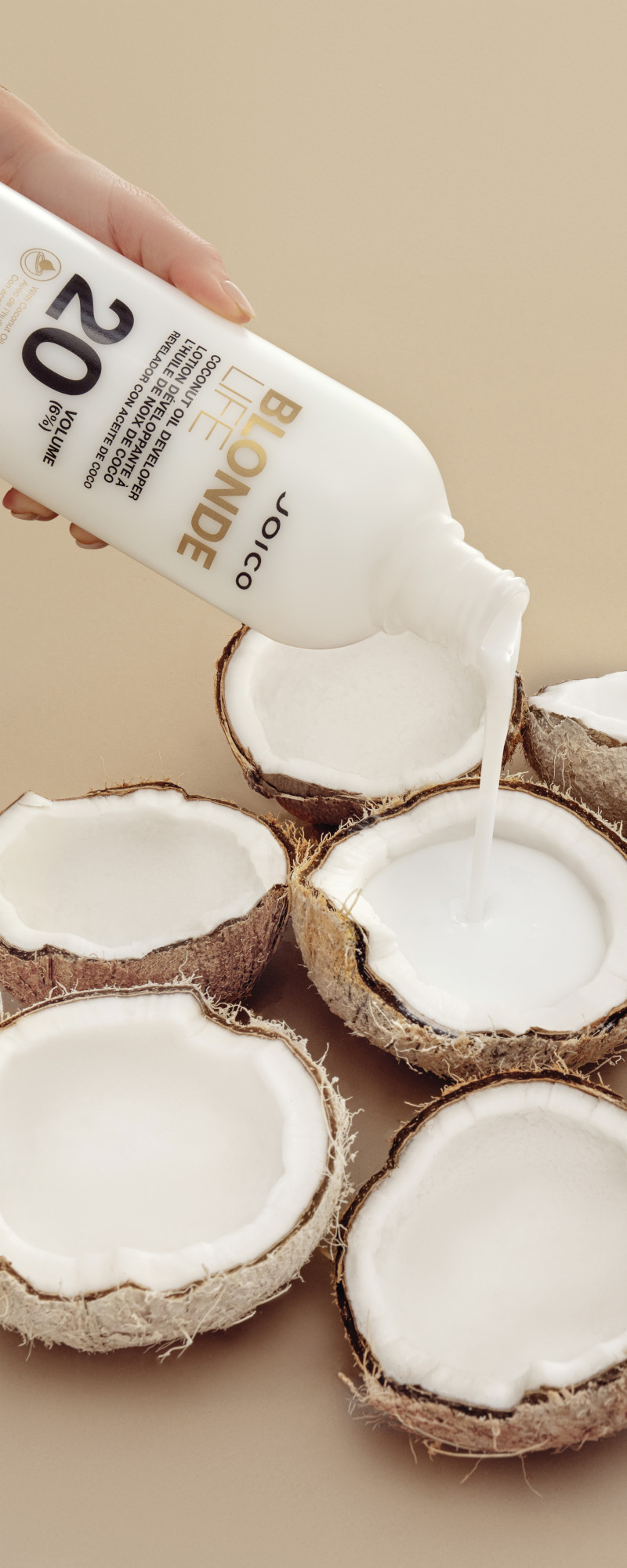 blonde life coconut oil developer being poured into coconuts